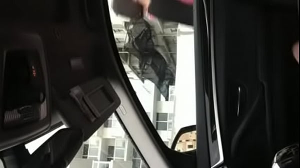 woman watches man jerkoff in car